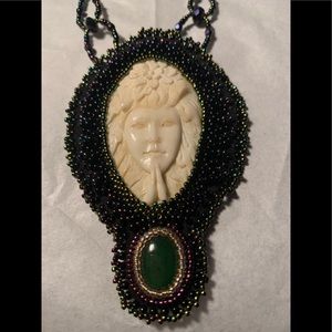 Handmade beaded pendant.